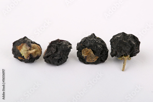Tablou pe pânză Traditional Chinese  black herbs dried wolfberry close up