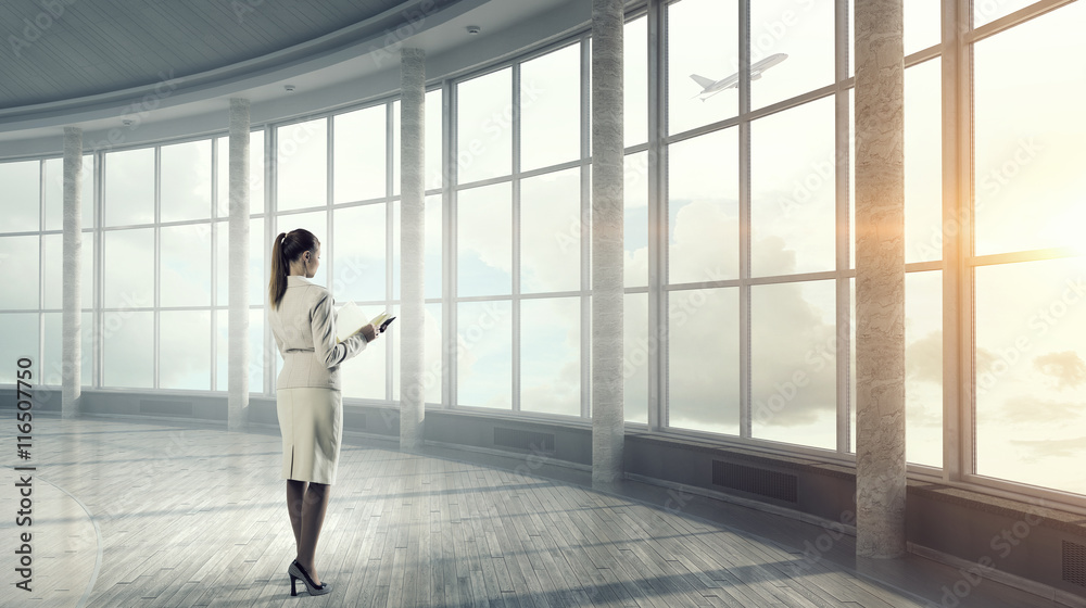 Businesswoman in modern office interior  . Mixed media