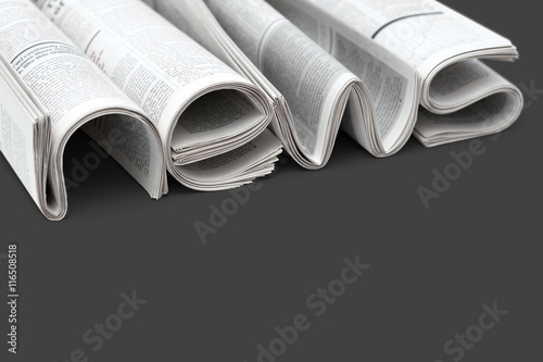 Folded modern newspapers. Concept of business news and print media