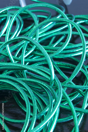 This is a photograph of Green woven Ribbons