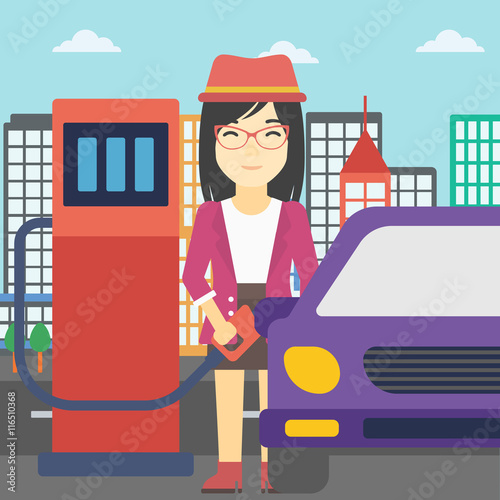 Worker filling up fuel into car.