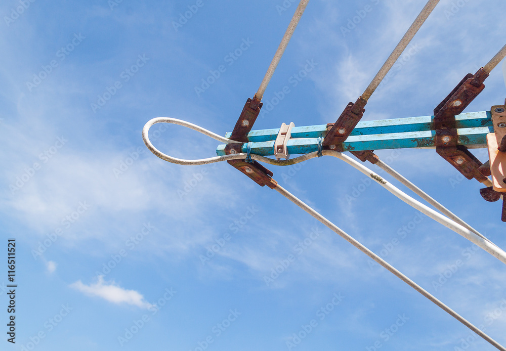 TV antenna, An old television antenna against a blue sky TV antenna, An old television antenna against a blue sky