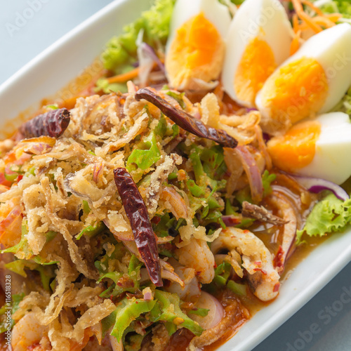 wing bean spicy salad with shrimp on white plate, Thai food, Thai people called "Yum Tua Phuu"