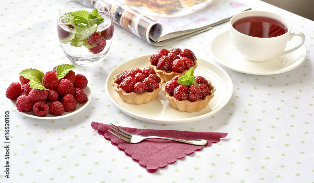Fruit raspberry tart cakes on a table