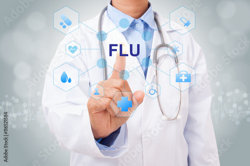 Doctor hand touching FLU sign on virtual screen. medical concept