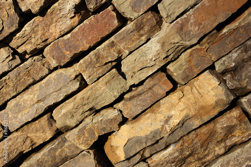 wall of natural stone on the diagonal