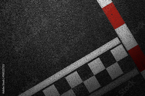 Level asphalted road with a dividing white and red stripes. The texture of the tarmac, top view. © srzaitsev
