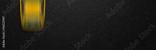 Smooth asphalt road and moving with high speed a yellow car. The texture of the tarmac, top view.