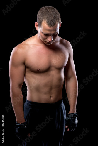 portrait of an athlete after a workout on a black background
