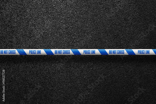 English white-blue police line in the background smooth asphalt road. Do not cross. The texture of the tarmac, top view.