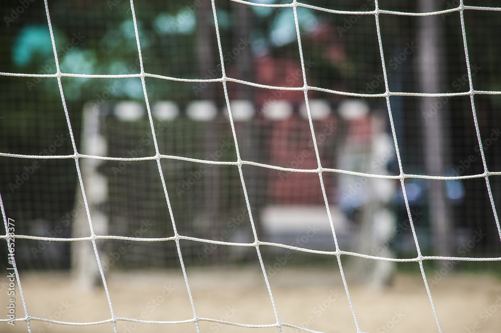 Beach soccer football goal through the net. Games in Brazil. Beach soccer football goal through the net. Games in Brazil.