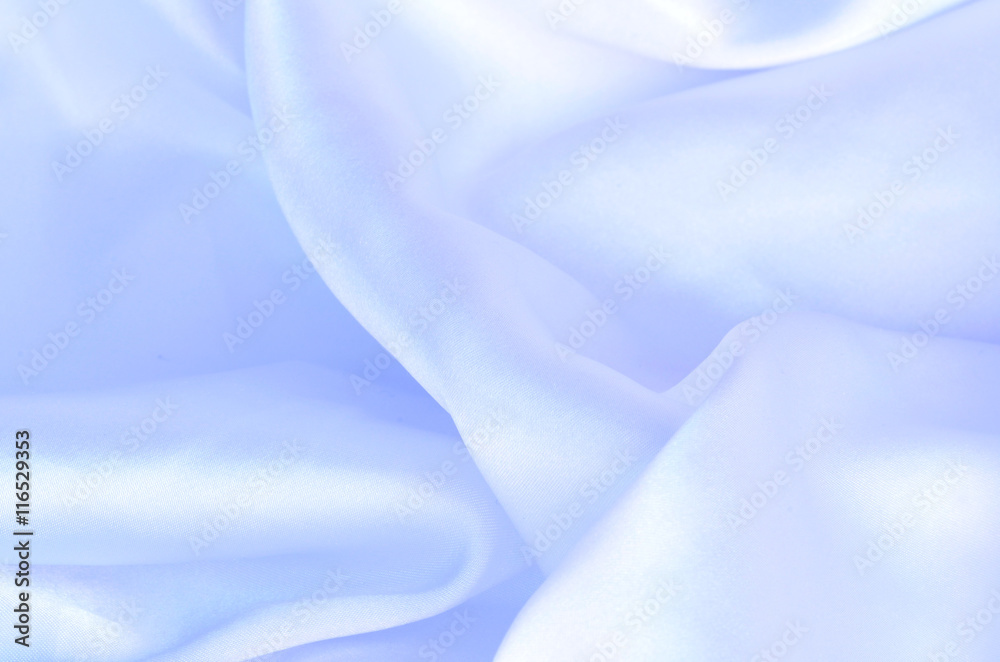 Smooth elegant blue silk, satin fabric background texture