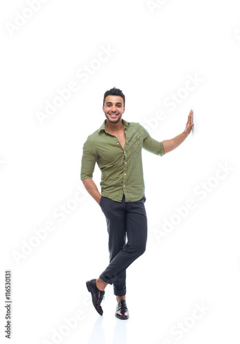 Casual business man happy smile young handsome guy hand on wall full length