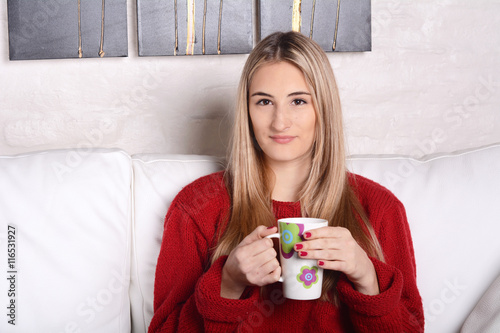 Young woman with a cup of coffee.