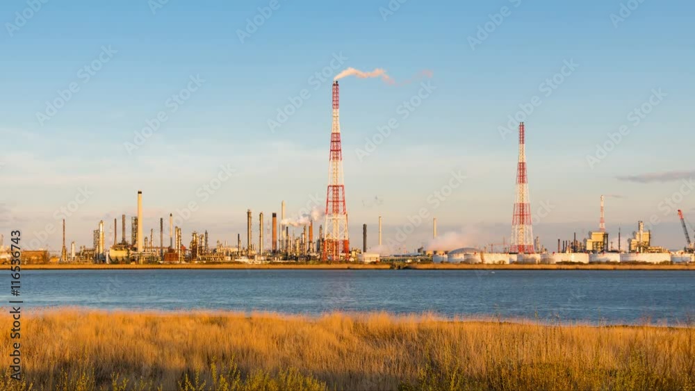 Timelapse sequence of a large oil refinery in the harbor of Antwerp, Belgium with blue sky and warm evening light in 4K. Timelapse sequence of a large oil refinery in the harbor of Antwerp, Belgium with blue sky and warm evening light in 4K.