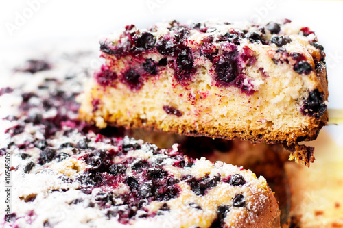 Tasty pie with blueberries on wooden table