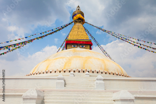 Photo of Boudhanath Stupa in the Kathmandu valley with clouds the sky Nepal. Horizontal.