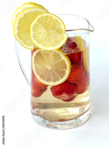 Strawberry Punch in a Glass Jug isolated on White Background