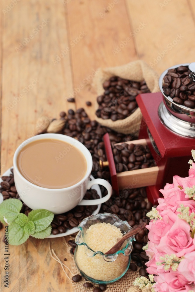 Coffee grinder with coffee beans and cup espresso. Coffee grinder with coffee beans and cup espresso.