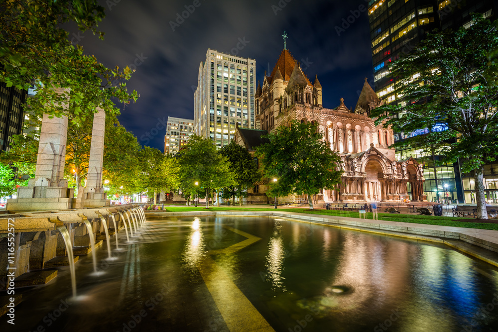 Fountains and Trinity Church at Copley Square at night, in Bosto