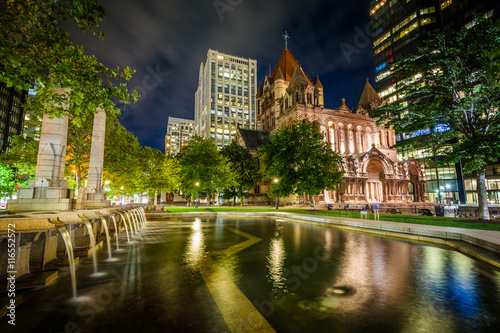 Fountains and Trinity Church at Copley Square at night, in Bosto