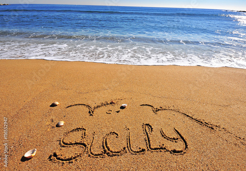 Sicily sign on the beach photo