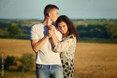 happy young couple posing high on country outdoor, romantic people concept, summer season © soleg