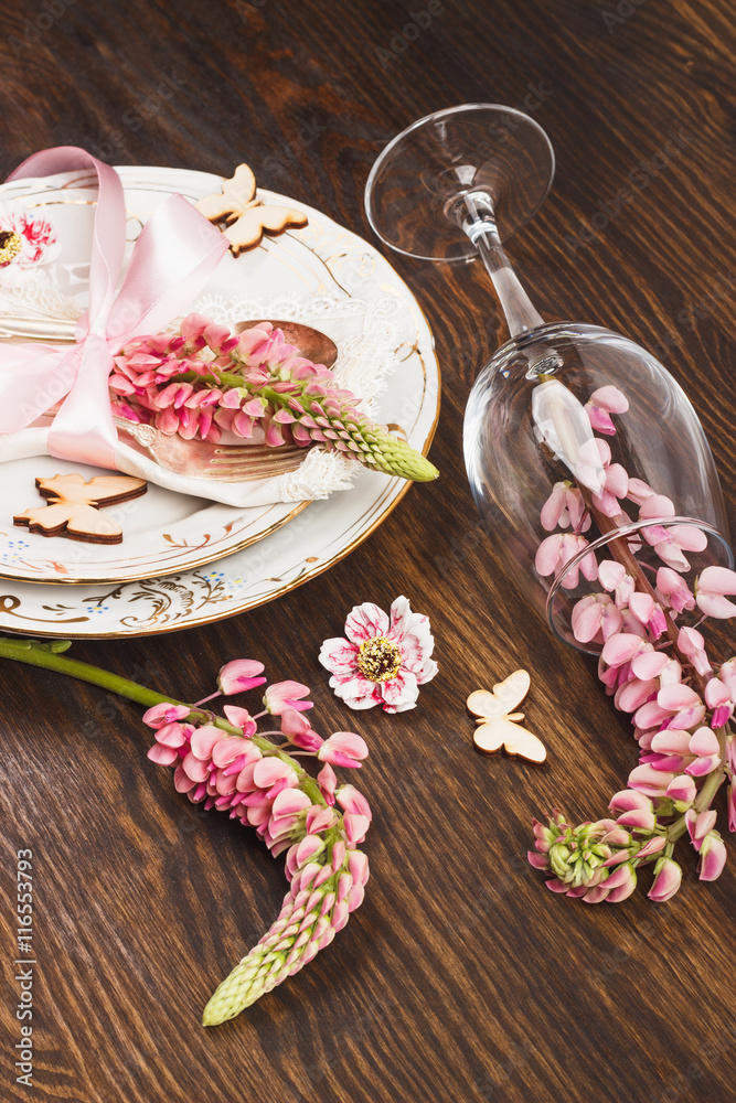Tableware with pink lupines and silverware Tableware with pink lupines and silverware