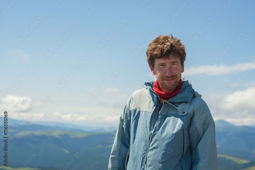 Portrait of a hiker on top