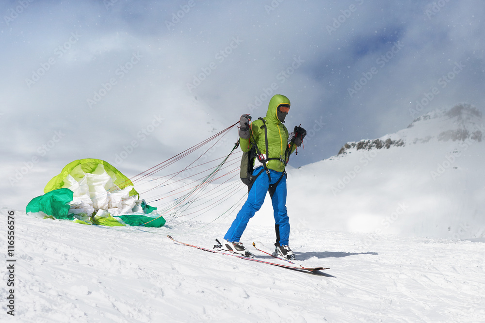  skier starts with lying paraglider