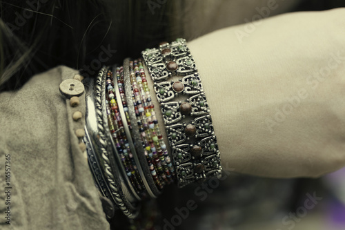 silver bracelets on female hand