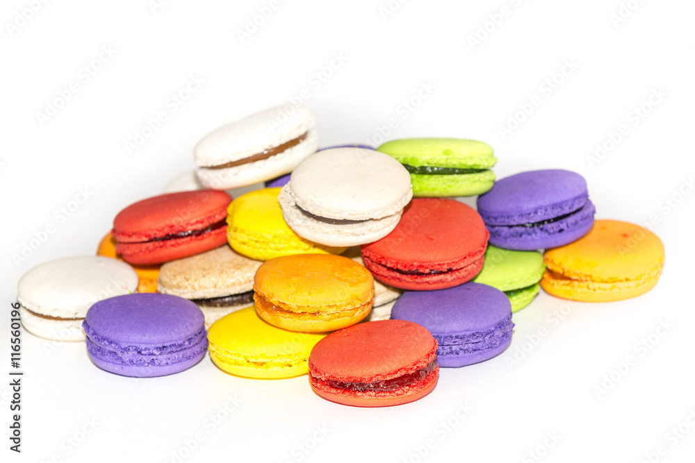 Testy french colorful macarons in a row, isolated on white Testy french colorful macarons in a row, isolated on white