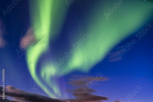 Bright green Northern lights (Aurora borealis) over the Iceland