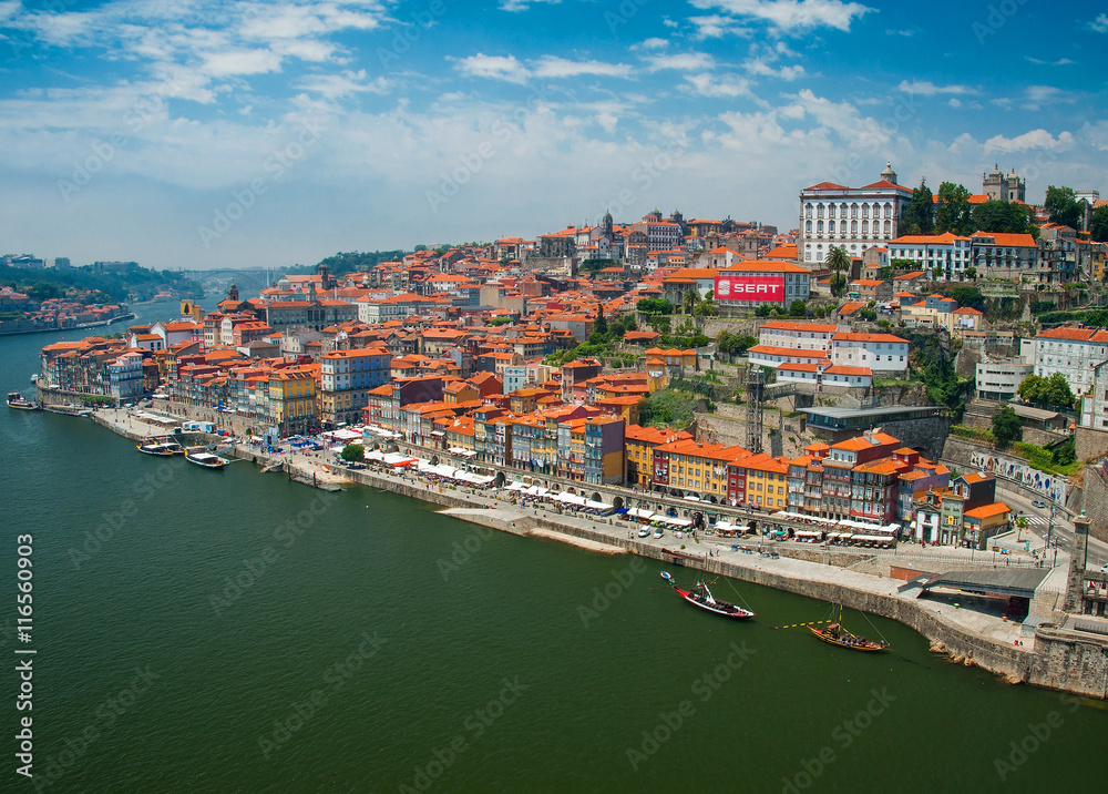 Old town cityscape on the Douro River with traditional Rabelo boats in Porto, Portugal