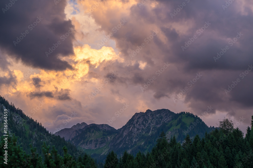 Stormy and dramatic clouds over the mountains near Oberstdorf, Germany
