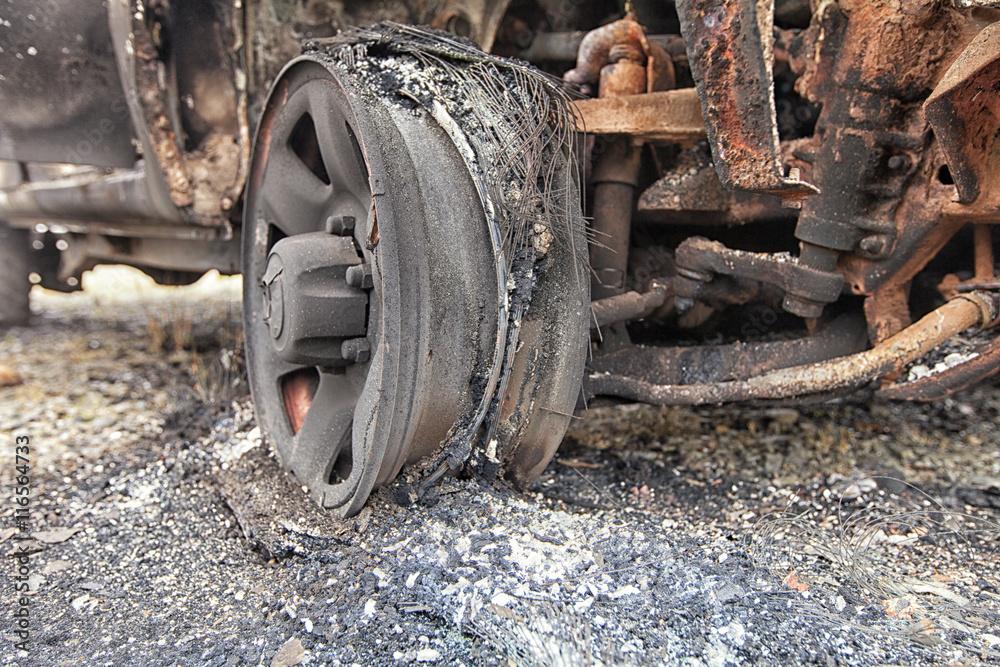 Close up of the remains of a car wheel after it was burnt.