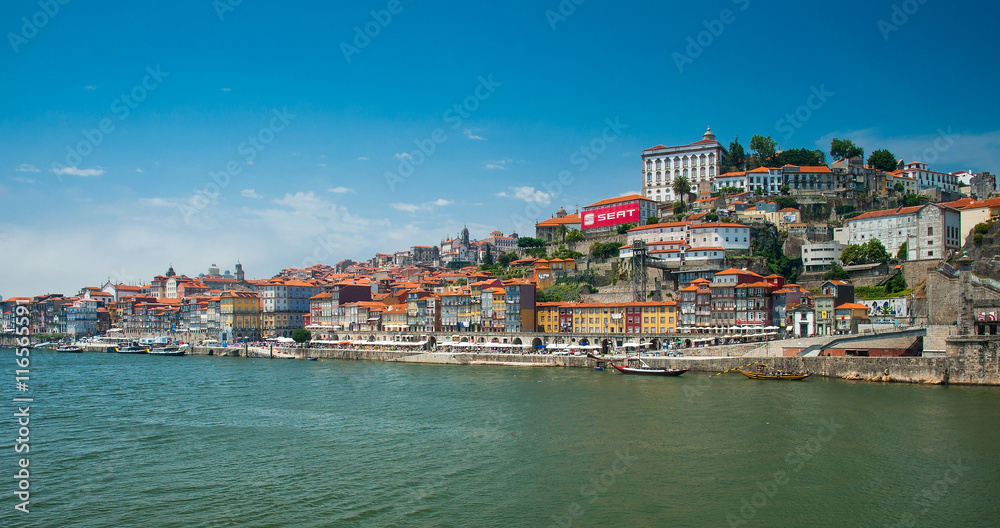 Old town cityscape on the Douro River with traditional Rabelo boats in Porto, Portugal