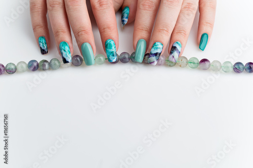 Closeup of woman hands with colorful nails photo