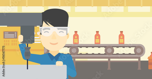 Man working on milling machine.