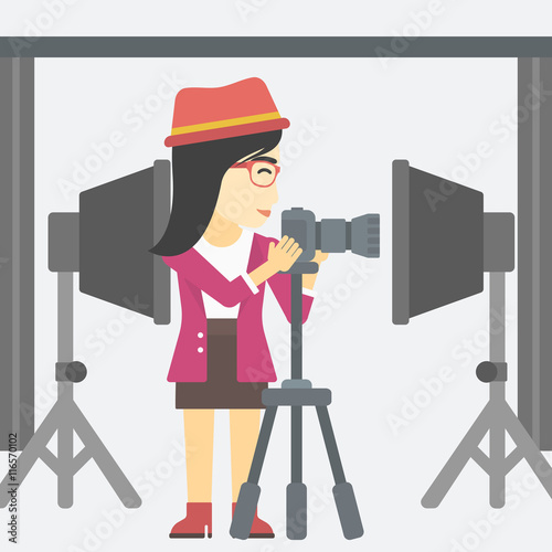 Photographer working with camera on tripod.