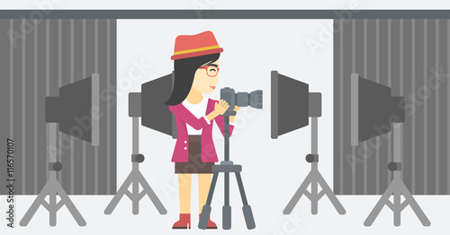 Photographer working with camera on tripod.