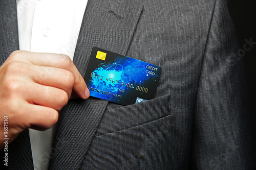 Man putting credit card in ...