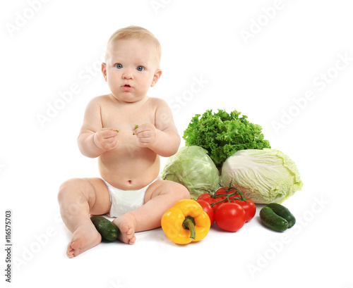 Cute baby and fresh vegetab...