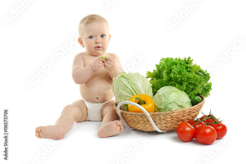 Cute baby and fresh vegetab...