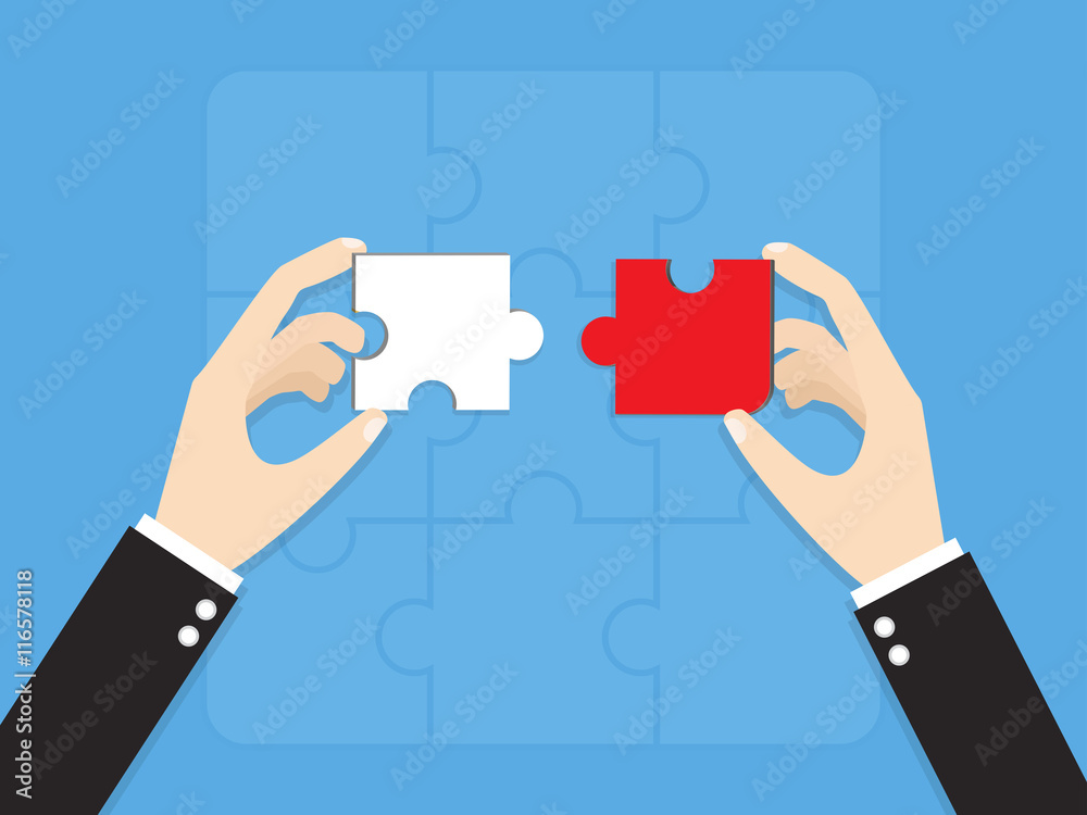 hands of businessman putting wrong way jigsaw puzzle pieces
