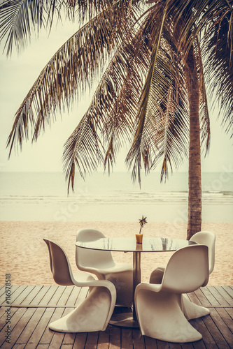 Fototapeta Naklejka Na Ścianę i Meble -  set of modern white beach chair and table on the beach