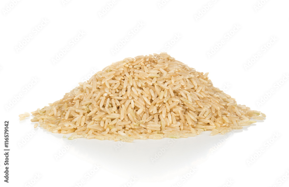 Heap of uncooked natural brown rice Heap of uncooked natural brown rice