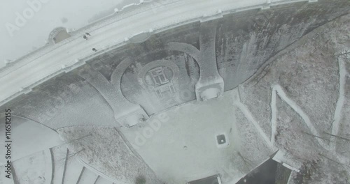 Aerial: The reservoir and bridge of Spindler Mill, Czech Republic in winter photo