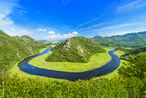 Canyon of Rijeka Crnojevica river near the Skadar lake coast. One of the most famous views of Montenegro. River makes a turn between the mountains and flows backward. © EMrpize