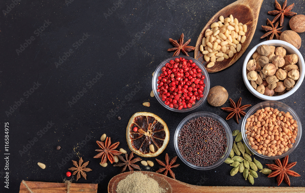 Composition of spices on a black background - copy space